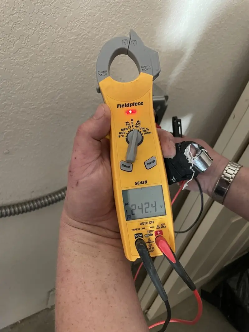 Voltage testing with clamp meter during Generator Installation in Granbury